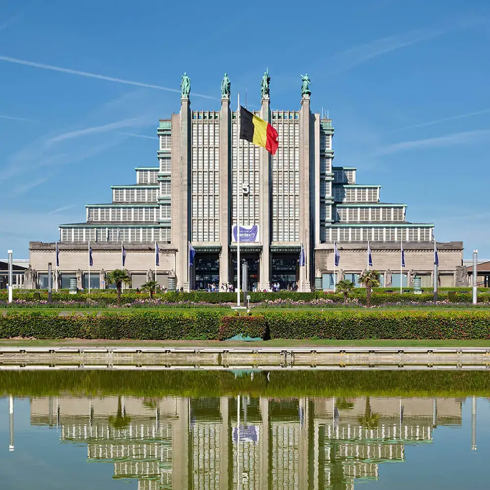 The Centenary Palace at Brussels Expo, with the Belgian flag flying above its colonnade