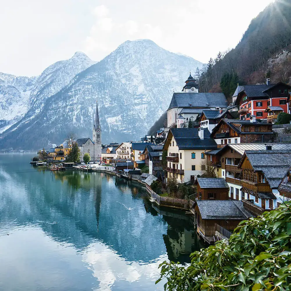 Swiss school building with mountains behind it